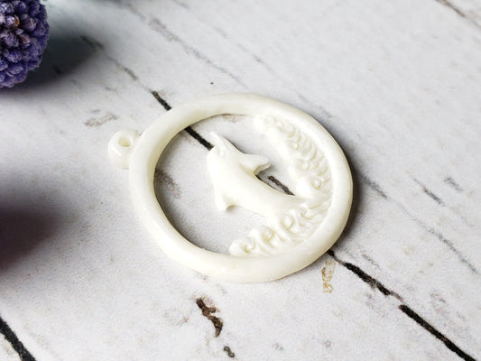 Dolphin with hole on top